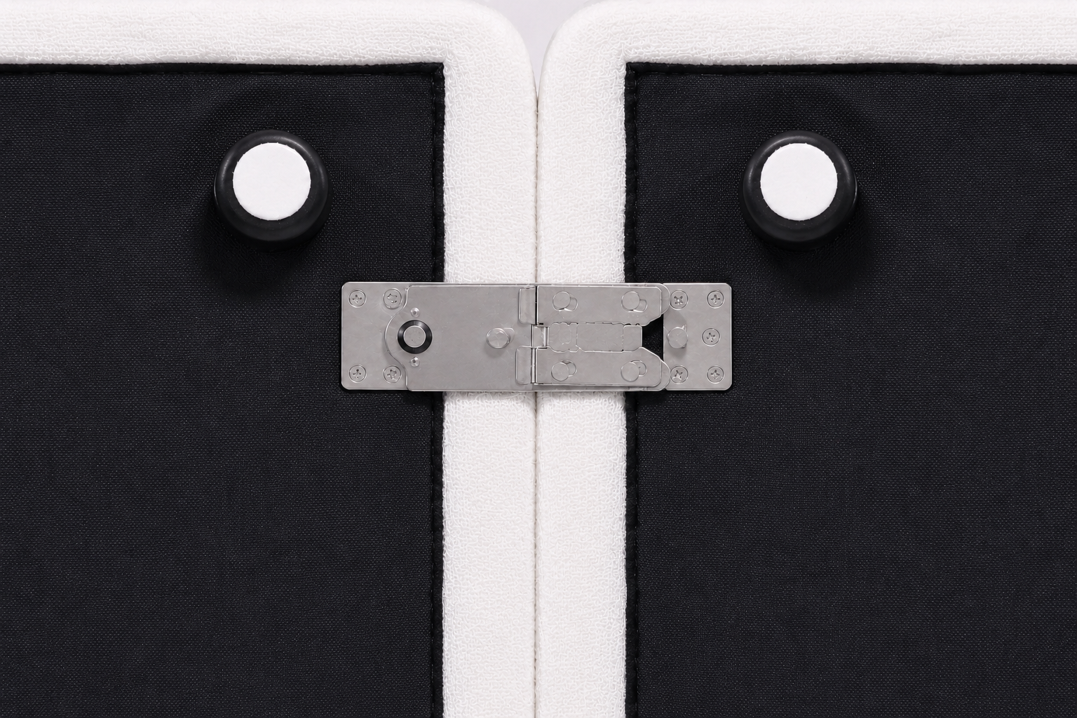 Metal connector securing two Ascend sofa modules together